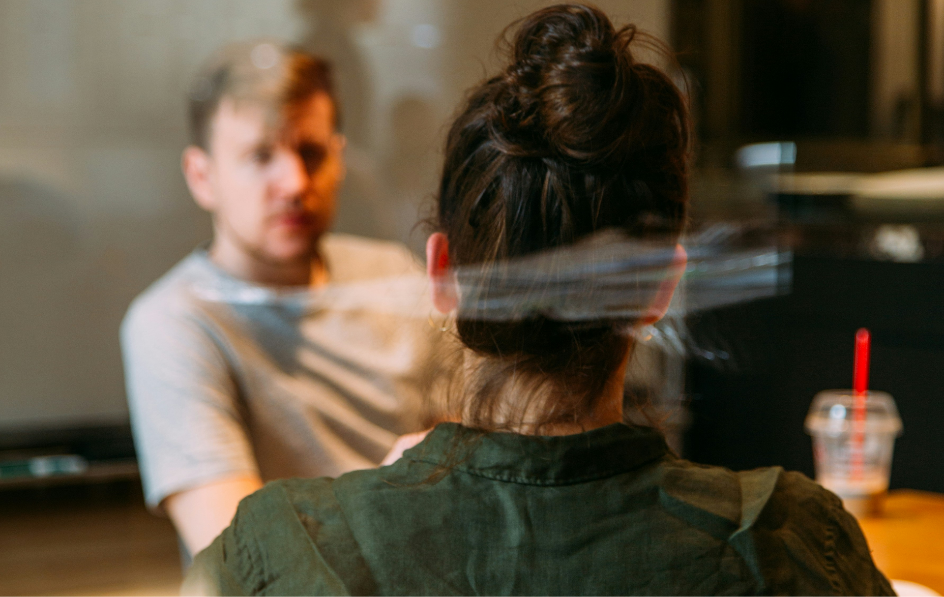 A man and a woman having a meeting in a coffee shop